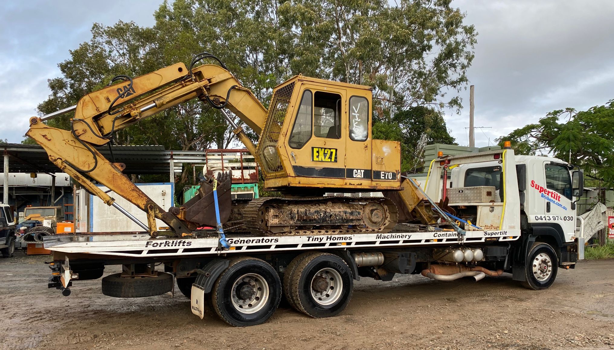 Excavator transport Brisbane — Cat E70 on tilt tray —