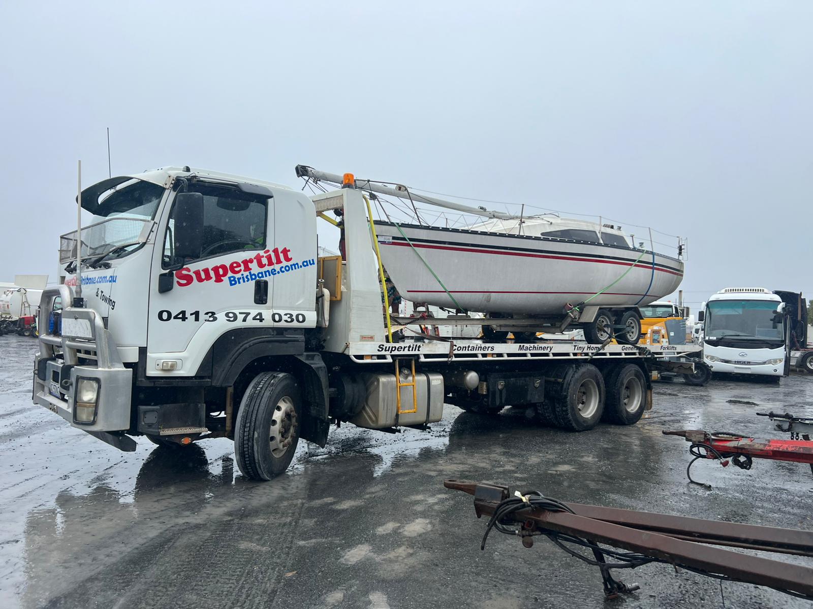 Boat transport Brisbane — yacht secured on tilt tray —
